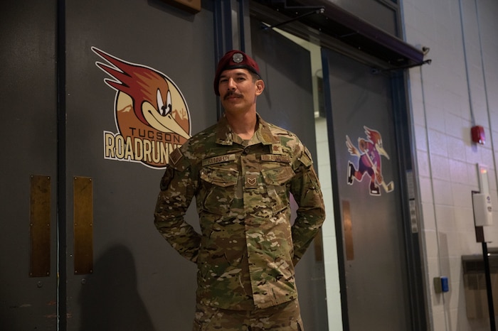 U.S. Air Force Staff Sgt. Dwayne Kennedy, 48th Rescue Squadron pararescueman, waits in the hallway near the arena at a Tucson Roadrunners hockey game, Tucson, Ariz., Nov. 4, 2023. Kennedy was selected to drop the puck at the start of the game. (U.S. Air Force photo by Airman 1st Class Robert Allen Cooke III)