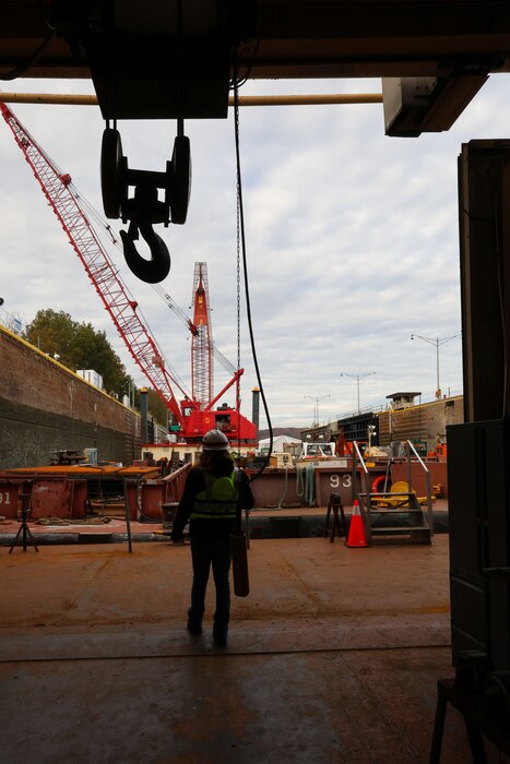 Kristen Haga, a U.S. Army Corps of Engineers safety specialist, provides occupational safety oversight on the Medium Capacity Fleet while it performs work at the Montgomery Locks and Dam in Monaca, Pennsylvania, Oct. 26, 2023.