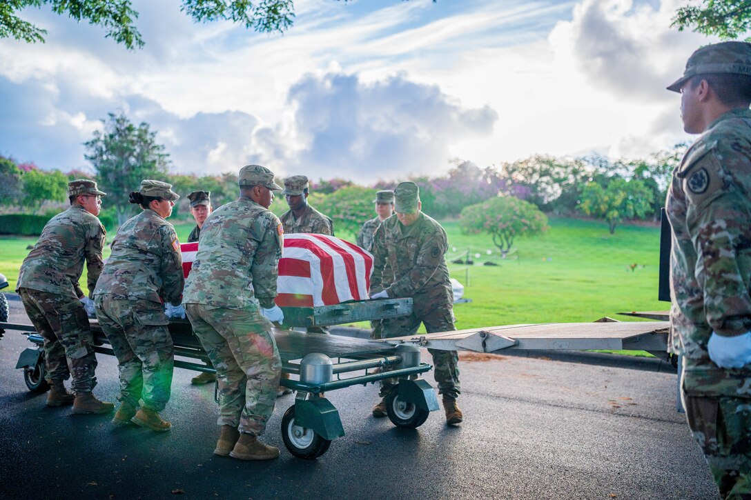 U.S. service members with the Defense POW/MIA Accounting Agency (DPAA) honor the fallen during a disinterment ceremony Oct. 23, 2023, at the National Memorial Cemetery of the Pacific (NMCP) in Honolulu, Hawaii. Given the large number of remains, DPAA has begun phase five of seven to disinter 652 sets of unknown remains associated with the Korean War that had been buried at the NMCP.  (U.S. Army photo by Sgt. Edward Randolph)
