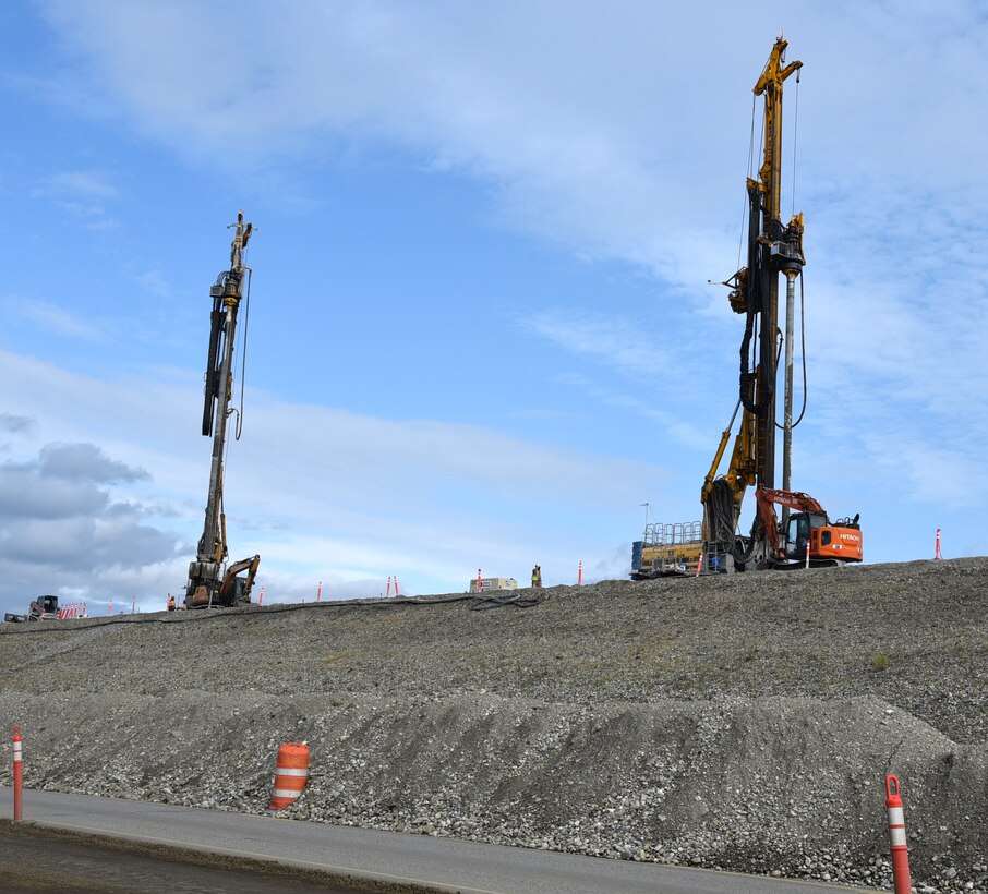 Construction equipment operates atop the 8-mile-long earthen embankment known as Moose Creek Dam at the Chena River Lakes Flood Control Project near North Pole, Alaska.