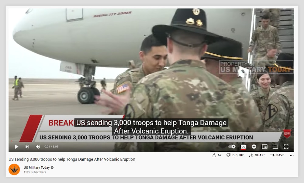 Screenshot of a paused 8-minute video displaying "Breaking News" and showing military personnel disembarking a Boeing 777-200ER aircraft. The video shows to have been uploaded by the US Military Today channel on January 18, 2022. The title of the video, the text on the video and the video's closed captioning all read, "US sending 3,000 troops to help Tonga Damage After Volcanic Eruption."