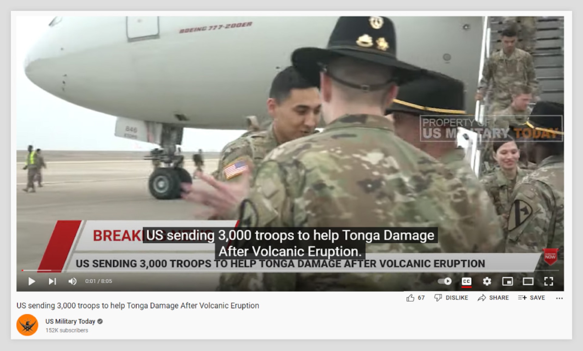 Screenshot of a paused 8-minute video displaying "Breaking News" and showing military personnel disembarking a Boeing 777-200ER aircraft. The video shows to have been uploaded by the US Military Today channel on January 18, 2022. The title of the video, the text on the video and the video's closed captioning all read, "US sending 3,000 troops to help Tonga Damage After Volcanic Eruption."