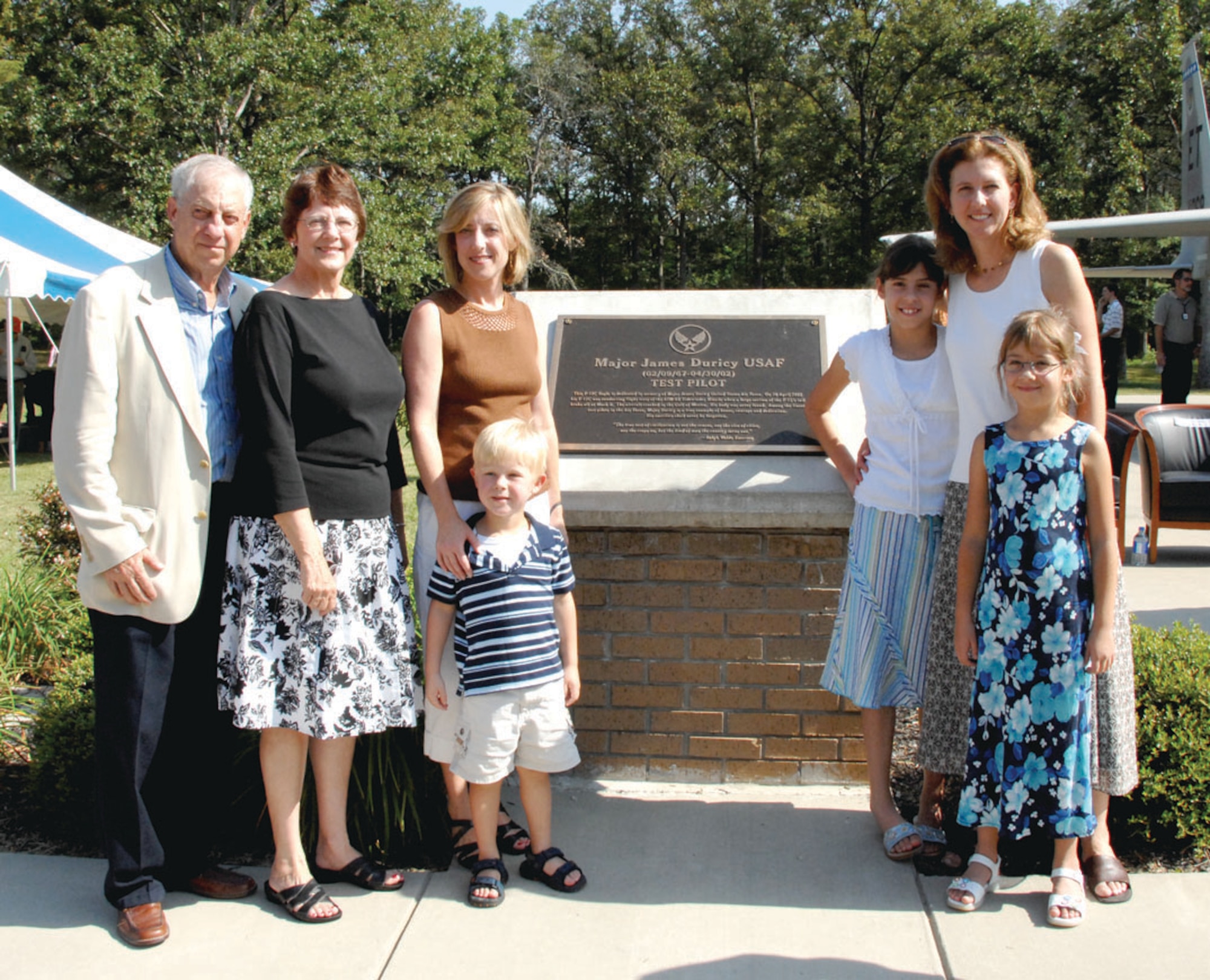 Maj. Jim Duricy’s parents Art and Irene Duricy, sister Christine Benigar and her son; widow Elaine Johnson and daughters Erin and Kate stand in front of the plaque honoring Maj. Duricy following the August 2007 ceremony to dedicate the F-15 Eagle static display at Arnold Air Force Base, Tenn., in memory of Maj. Duricy. Maj. Duricy died April 30, 2002, when he was forced to eject at a high speed as the F-15C he piloted crashed into the Gulf of Mexico. His body was never found. A 12-year test pilot, Maj. Duricy was assigned to the 40th Flight Test Squadron based at Eglin Air Force Base, Fla., at the time of his death. He was on a captive flight development test of a new missile when the aircraft crashed. (U.S. Air Force photo by David Housch)