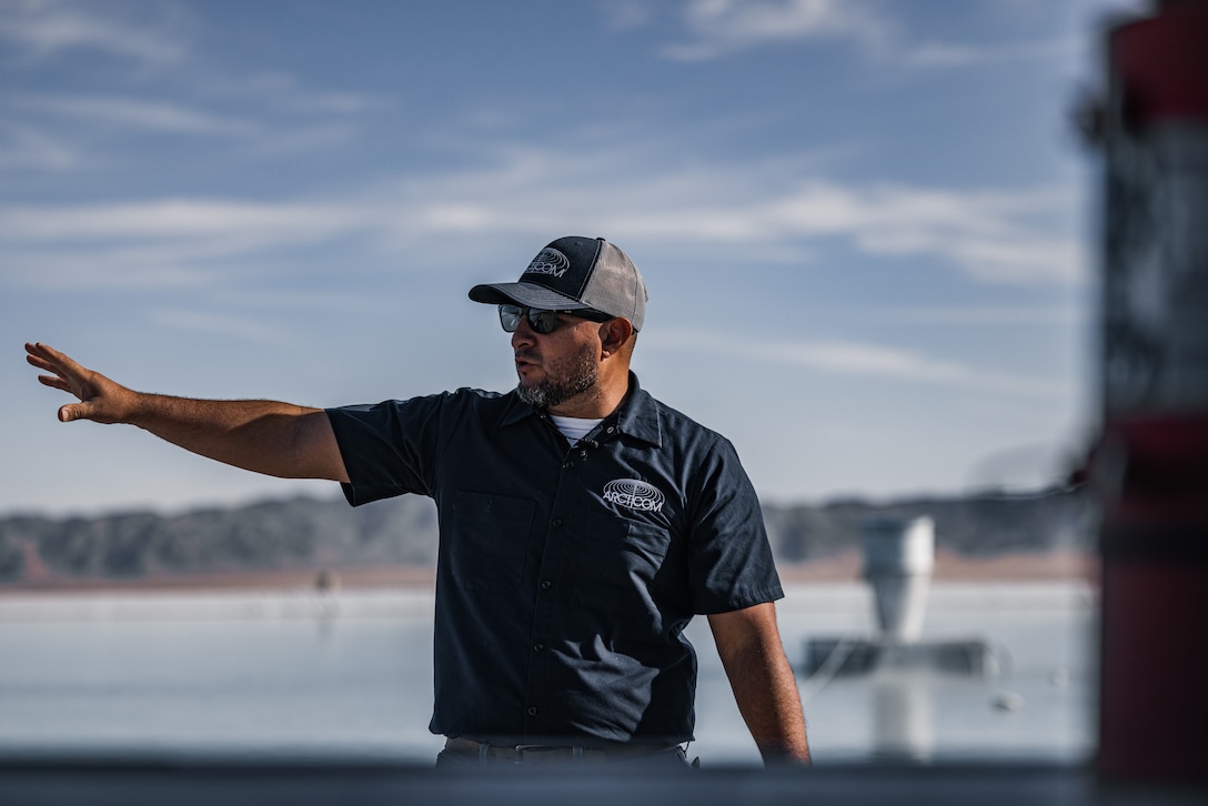 Daniel Urrutia, chief water plant operator for The Combat Center’s water treatment facility, explains the evaporation ponds capabilities at the water treatment facility located at Marine Corps Air-Ground Combat Center, Twentynine Palms, California, Oct. 17, 2023. The facility represents a substantial investment in ensuring both long term water quality and security for The Combat Center. The mission of the water treatment facility is to provide The Combat Center with safe and reliable drinking water to all service members, civilians, and their families. (U.S. Marine Corps photo by Lance Cpl. Justin J. Marty)