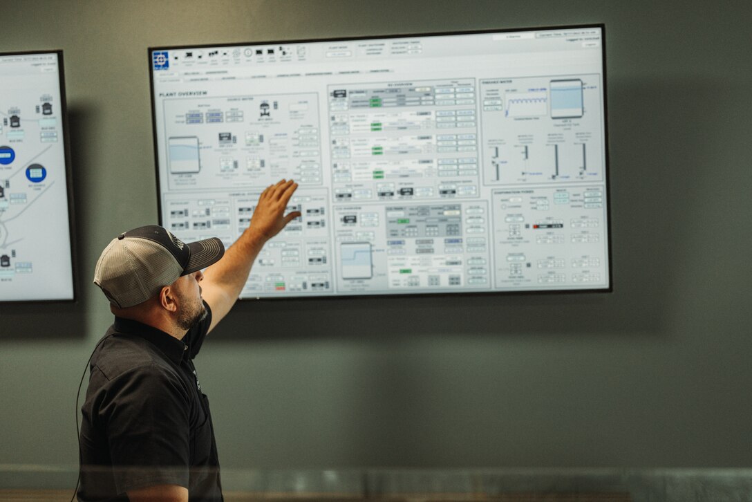 Daniel Urrutia, chief water plant operator for The Combat Center’s water treatment facility, explains the control center at the water treatment facility, Marine Corps Air-Ground Combat Center, Twentynine Palms, California, Oct. 17, 2023. The facility represents a substantial investment in ensuring both long term water quality and security for The Combat Center. The mission of the water treatment facility is to provide The Combat Center with safe and reliable drinking water to all service members, civilians, and their families. (U.S. Marine Corps photo by Lance Cpl. Justin J. Marty)