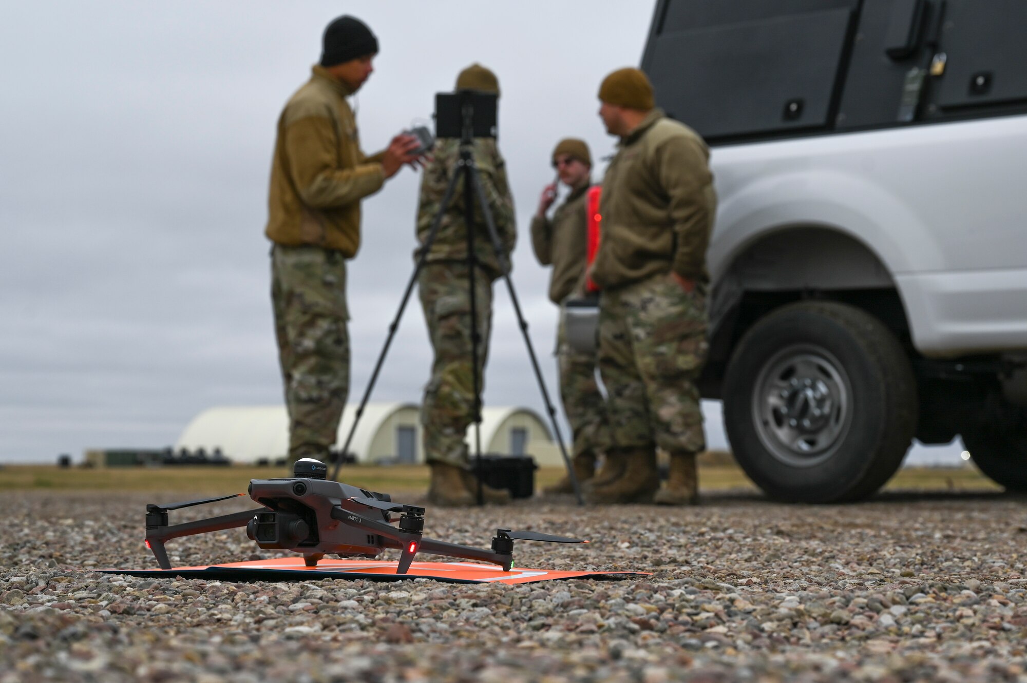 Airmen prepare to fly a drone