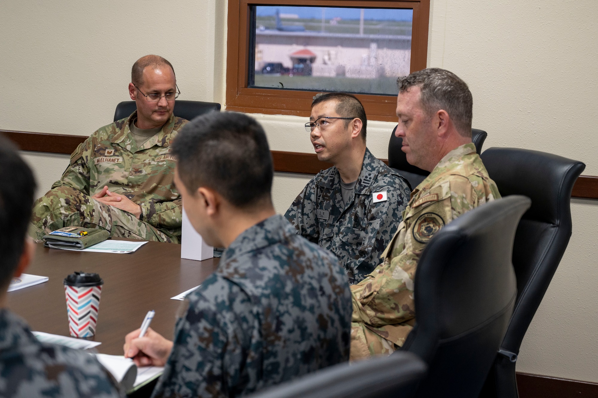 U.S. Air Force, Philippine Air Force and Japan Air Self-Defense Force leaders have a discussion at Andersen Air Force Base, Guam, Nov. 2, 2023. The 36th Contingency Response Group and the 36th Tactical Advisory Squadron hosted a trilateral discussion to facilitate discussions on regional security concerns, humanitarian aid and disaster relief, exercises, and operations. (U.S. Air Force photo by Senior Airman Emily Saxton)