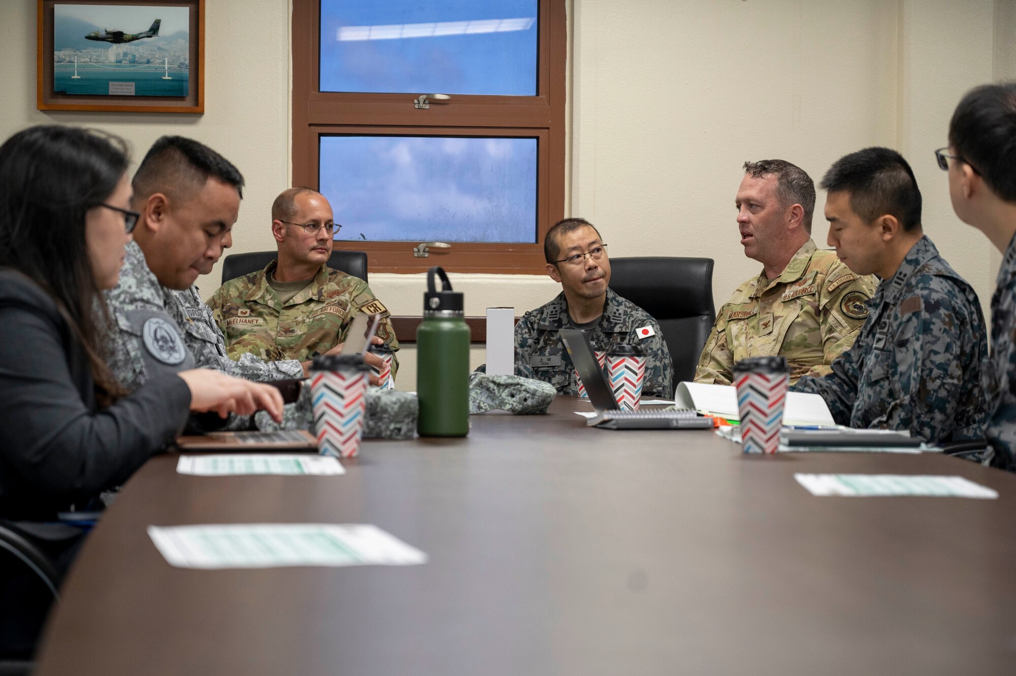U.S. Air Force, Philippine Air Force and Japan Air Self-Defense Force leaders have a discussion at Andersen Air Force Base, Guam, Nov. 2, 2023. The 36th Contingency Response Group and the 36th Tactical Advisory Squadron hosted a trilateral discussion to facilitate discussions on regional security concerns, humanitarian aid and disaster relief, exercises, and operations. (U.S. Air Force photo by Senior Airman Emily Saxton)