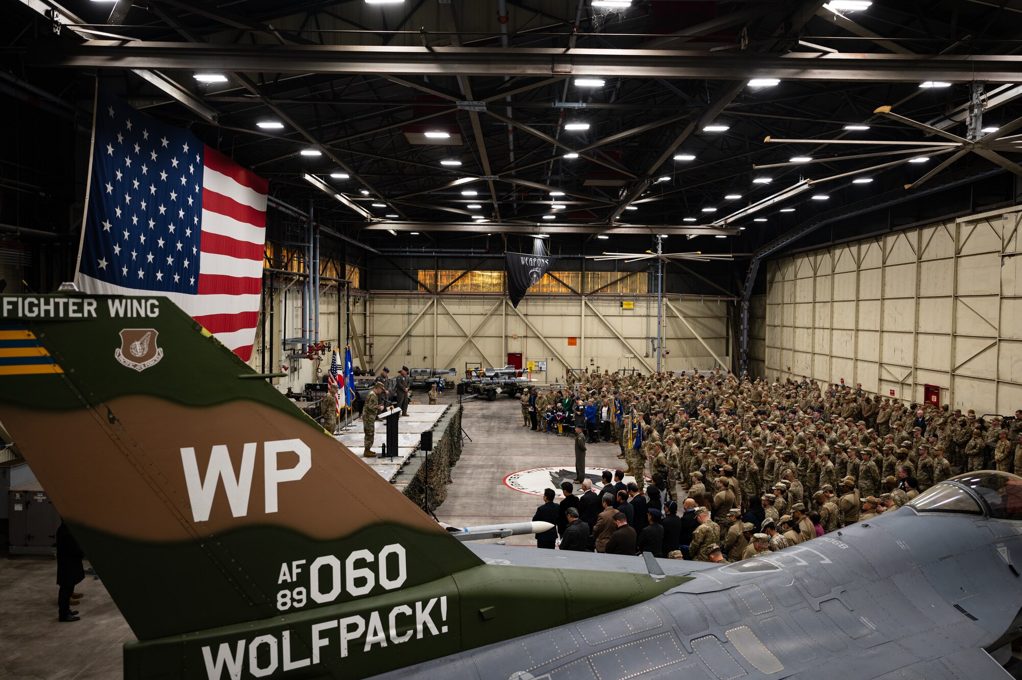 Airmen from the 8th Fighter Wing gather to welcome Col. Matthew C. Gaetke during the assumption of command ceremony.