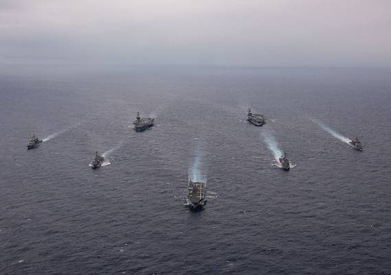 PHILIPPINE SEA (Nov. 7, 2023) Nimitz-class aircraft carriers, USS Ronald Reagan (CVN 76) and USS Carl Vinson (CVN 70), steam in formation with Japan Maritime Self-Defense Force (JMSDF) first-in-class helicopter destroyer, JS Hyuga (DDH 181), Ticonderoga-class guided-missile cruisers, USS Antietam (CG 54) and USS Robert Smalls (CG 62), and Arleigh Burke-class guided-missile destroyers, USS Sterett (DDG 104) and USS Kidd (DDG 100), during the Multi-Large Deck Exercise (MLDE) in the Philippine Sea, Nov. 7. Ronald Reagan is participating in the bilateral MLDE, which features the ships and aircraft of JMSDF Escort Flotilla 3, as well as the U.S. Navy’s Carrier Strike Group 1 and Carrier Strike Group 5. MLDE is a multi-domain event that grows the already strong partnership and interoperability that exists between the JMSDF and U.S. Navy today. (U.S. Navy photo by Mass Communication Specialist 3rd Class Natasha ChevalierLosada)