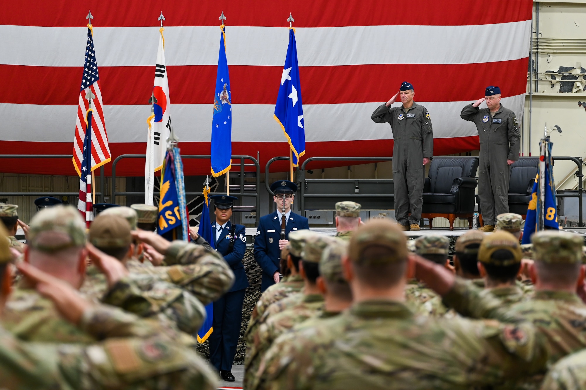 Lt. Gen. Scott Pleus nd Col. Matthew C. Gaetke render a salute during the U.S. and Republic of Korea national anthems during the 8th FW Assumption of Command ceremony.
