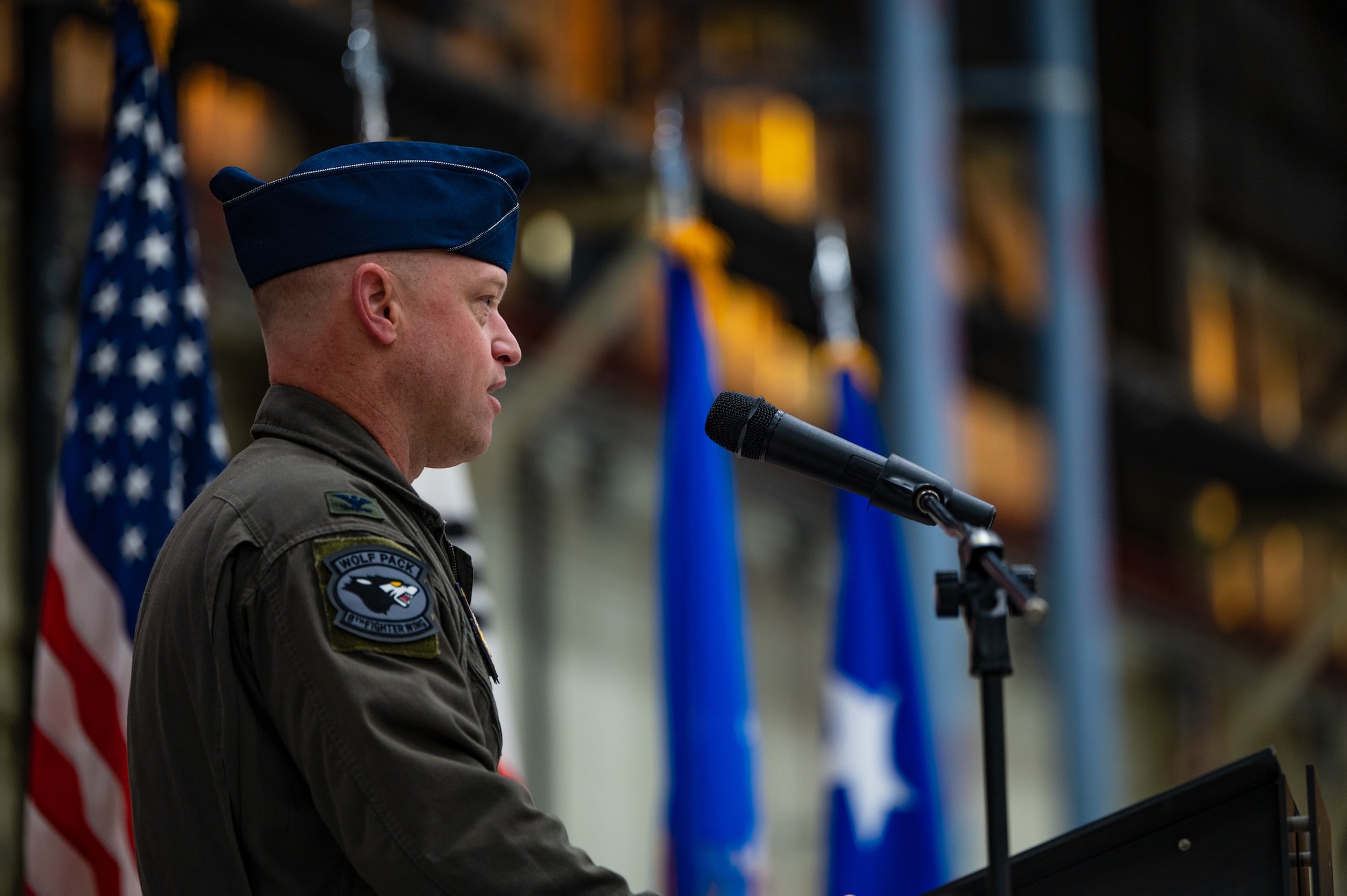 Col. Matthew C. Gaetke delivers a speech after taking command of the Wolf Pack.