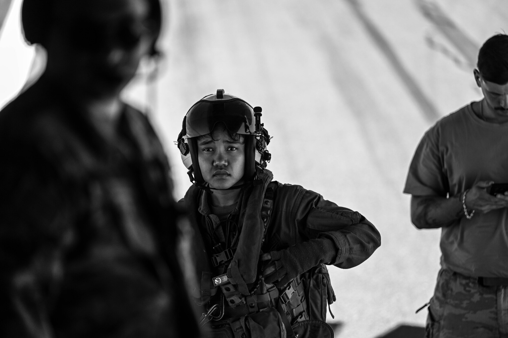 A U.S. Marine looks into a C-130J aircraft.