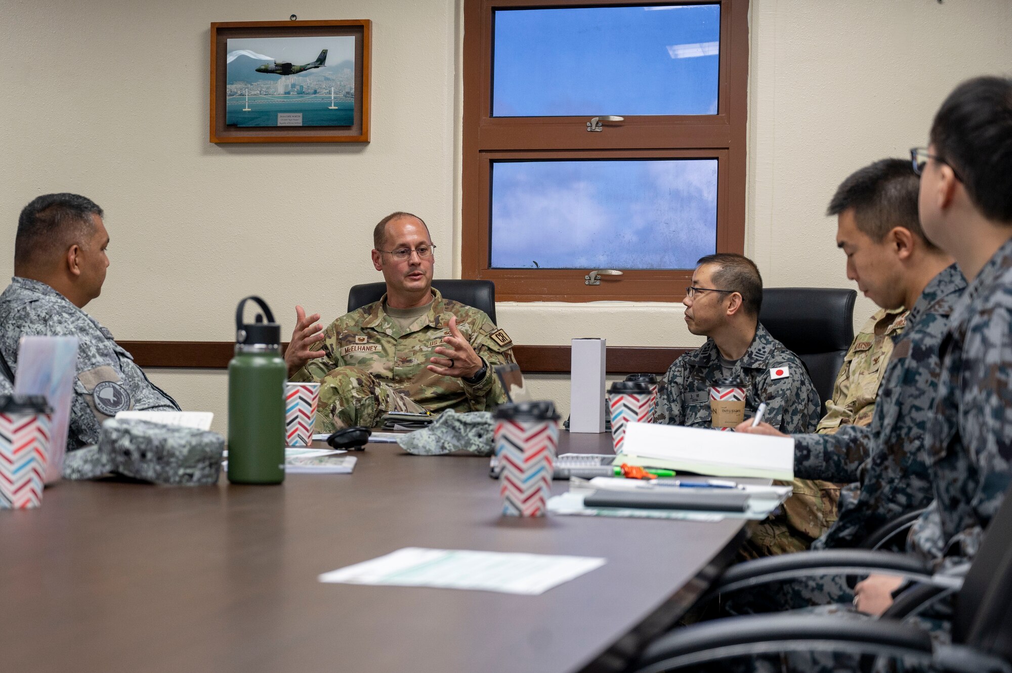 U.S. Air Force, Philippine Air Force and Japan Air Self-Defense Force leaders have a discussion at Andersen Air Force Base, Guam, Nov. 2, 2023. The 36th Contingency Response Group and the 36th Tactical Advisory Squadron hosted a trilateral discussion to facilitate discussions on regional security concerns, humanitarian aid and disaster relief, exercises, and operations. (U.S. Air Force photo by Senior Airman Emily Saxton)