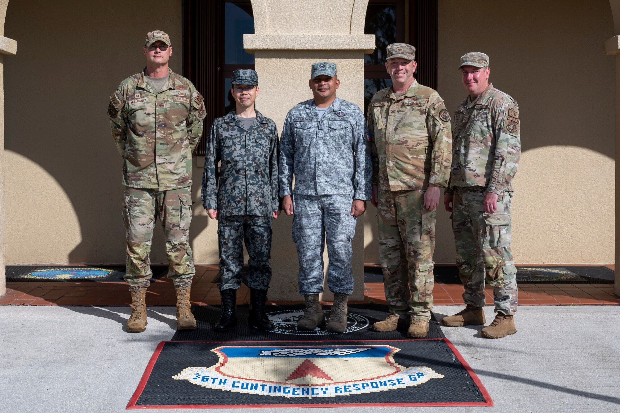 U.S. Air Force, Philippine Air Force and Japan Air Self-Defense Force leaders pose for a photo at Andersen Air Force Base, Guam, Nov. 2, 2023. The 36th Contingency Response Group and the 36th Tactical Advisory Squadron hosted a trilateral discussion to facilitate discussions on regional security concerns, humanitarian aid and disaster relief, exercises, and operations. (U.S. Air Force photo by Senior Airman Emily Saxton)