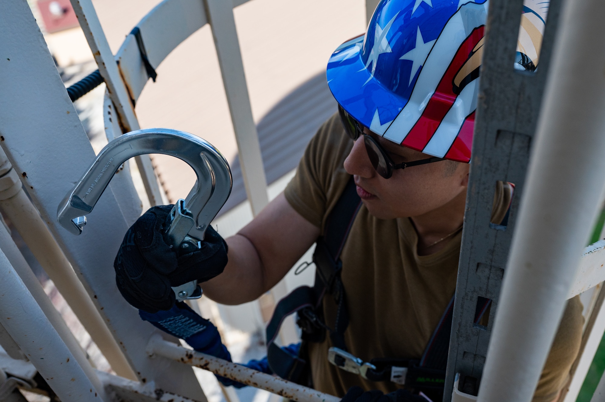 Lt. Col. John Kim secures his safety harness while scaling a water tower at Kunsan Air Base.