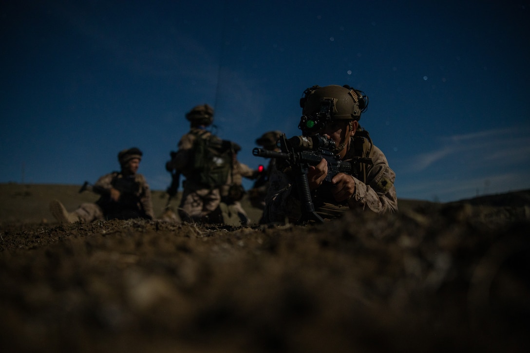 U.S. Marines Corps Sgt. Matthew Unrein, a Morrill, Nebraska native and a squad leader with Fleet Anti-Terrorism Security Team Company, Europe (FASTEUR), holds security during a night patrol with Spanish Marines from the Spanish Mechanized Infantry as part of exercise Lisa Azul 23 at Sierra del Retín Training Camp, Spain, Sept. 27, 2023. Task Force 61/2.3 (FASTEUR), under the tactical command and control of Task Force 61/2, provides capabilities such as rapid response expeditionary anti-terrorism and security operations in support of Commanders, United States European Command (COMESEUCOM) and as directed by Commander, U.S. 6th Fleet (C6F) in order to protect vital naval and national assets. (U.S. Marine Corps photo by Lance Cpl. Jack Labrador)