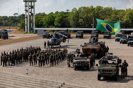 Brazilian soldiers stand alongside army equipment and vehicles during the opening ceremony for Exercise Southern Vanguard 24 in Macapa, Brazil, Nov. 6, 2023.