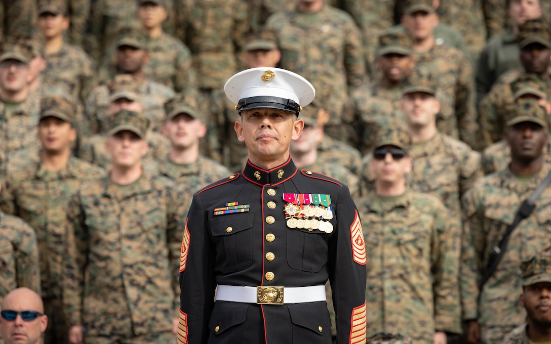 U.S. Marine Corps Sgt. Maj. Carlos A. Ruiz, 20th Sergeant Major of the Marine Corps, a native of Sonora, Mexico, stands at attention during the Marine Corps cake cutting ceremony in honor of the 248th Marine Corps Birthday at Butler Stadium on Marine Corps Base Quantico, Virginia, Nov. 7, 2023. The annual cake cutting ceremony is a long-standing tradition that celebrates the establishment of the United States Marine Corps. The Marine Corps birthday is celebrated every year to commemorate the birth of the Corps and honor the service and sacrifices of all Marines, past and present. (U.S. Marine Corps photo by Cpl. Mitchell Johnson)