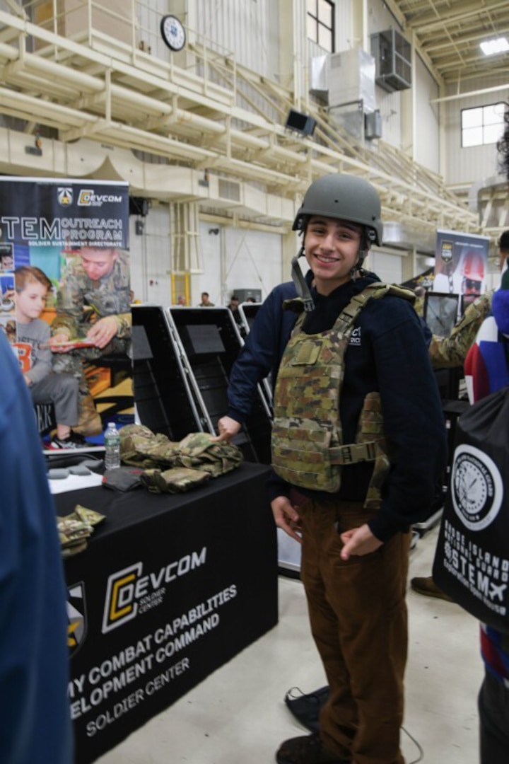 The U.S. Army Combat Capabilities Development Command Soldier Center, or DEVCOM SC, recently participated in a STEM Exploration Open House hosted by the Rhode Island National Guard in North Kingstown, Rhode Island. An event participant dons a helmet and plate carrier.