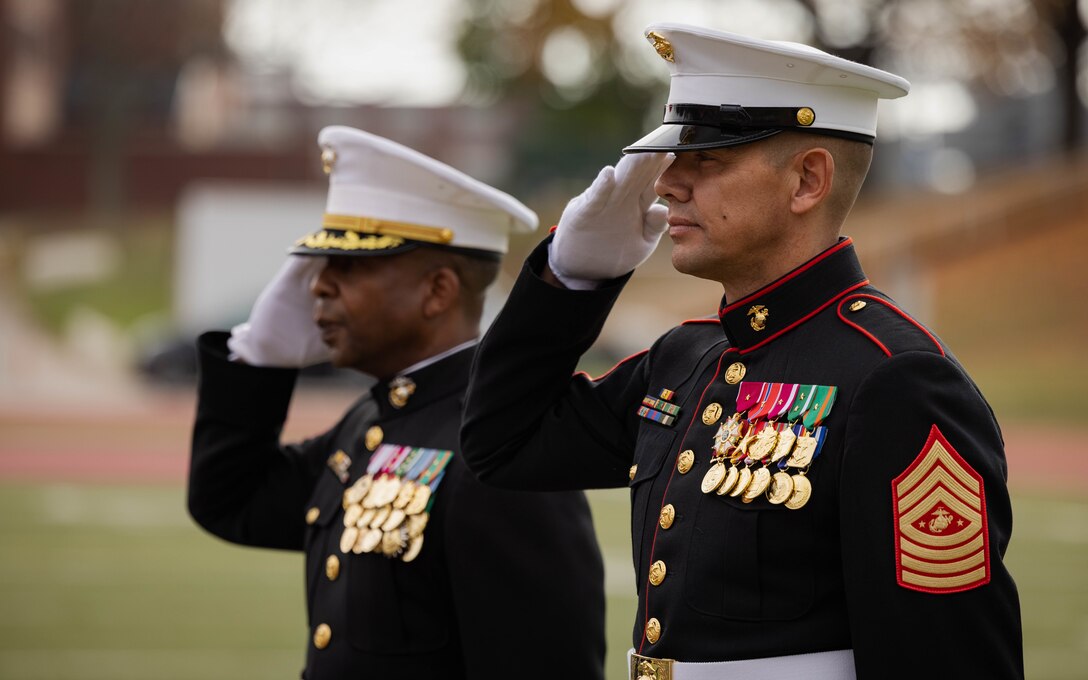 U.S. Marine Corps U.S. Marine Corps Col. Michael L. Brooks, base commander, Marine Corps Base Quantico, a native of South Boston, Virginia, left, and Sgt. Maj. Carlos A. Ruiz, 20th Sergeant Major of the Marine Corps, a native of Sonora, Mexico, right, salute during the Marine Corps cake cutting ceremony in honor of the 248th Marine Corps Birthday at Butler Stadium on MCBQ, Virginia, Nov. 7, 2023. The annual cake cutting ceremony is a long-standing tradition that celebrates the establishment of the United States Marine Corps. The Marine Corps birthday is celebrated every year to commemorate the birth of the Corps and honor the service and sacrifices of all Marines, past and present. (U.S. Marine Corps photo by Cpl. Mitchell Johnson)