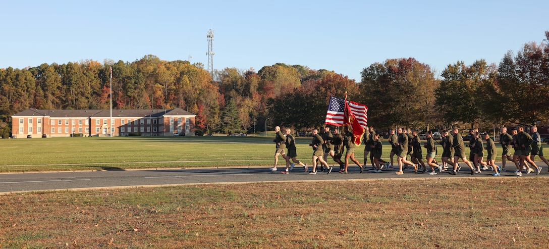 U.S. Marine Corps Lt. Gen. James Glynn, Deputy Commandant for Manpower and Reserve Affairs, a native of Albany, New York, left, and Sgt. Maj. Jacob Rieff, Sergeant Major of M&RA, a native of Wisconsin, right, lead a running formation honoring the Marine Corps Birthday on Marine Corps Base Quantico, Virginia, Nov. 3, 2023. The formation run promoted unit cohesion, physical fitness and celebrated the 248nd Marine Corps Birthday. (U.S. Marine Corps photo by Lance Cpl. David Brandes)