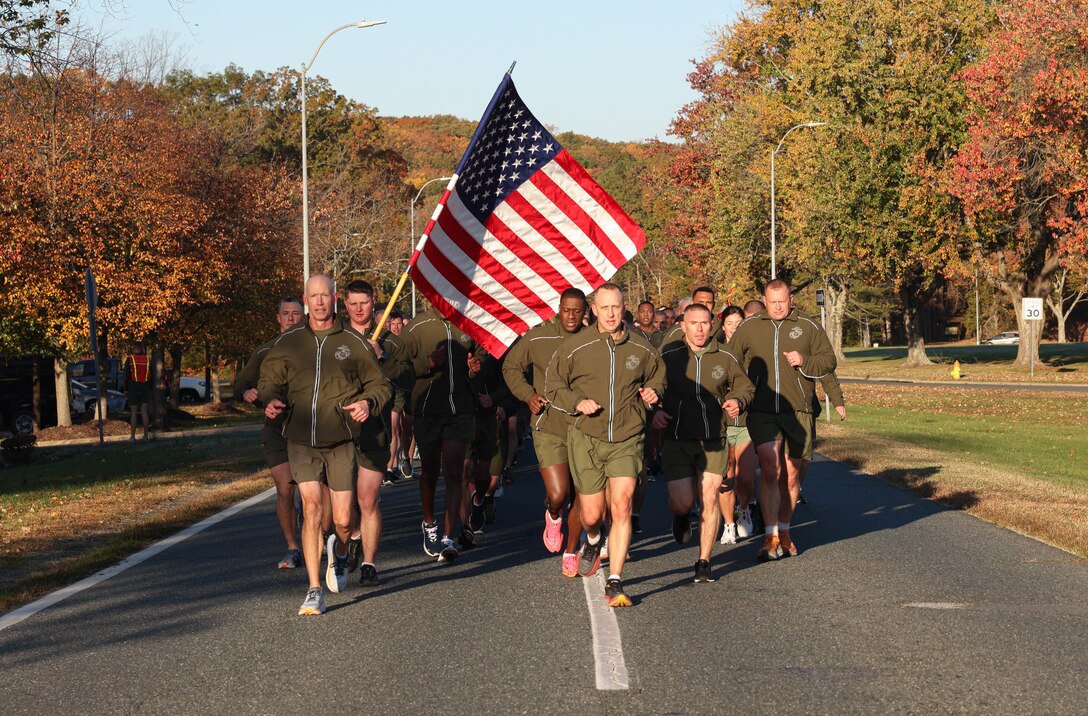 U.S. Marine Corps Lt. Gen. James Glynn, Deputy Commandant for Manpower and Reserve Affairs, a native of Albany, New York, left, and Sgt. Maj. Jacob Rieff, Sergeant Major of M&RA, a native of Wisconsin, right, lead a running formation honoring the Marine Corps Birthday on Marine Corps Base Quantico, Virginia, Nov. 3, 2023. The formation run promoted unit cohesion, physical fitness and celebrated the 248nd Marine Corps Birthday. (U.S. Marine Corps photo by Lance Cpl. David Brandes)