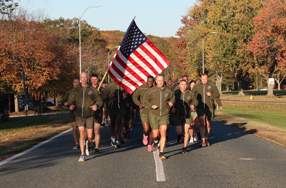 U.S. Marine Corps Lt. Gen. James Glynn, Deputy Commandant for Manpower and Reserve Affairs, a native of Albany, New York, left, and Sgt. Maj. Jacob Rieff, Sergeant Major of M&RA, a native of Wisconsin, right, lead a running formation honoring the Marine Corps Birthday on Marine Corps Base Quantico, Virginia, Nov. 3, 2023. The formation run promoted unit cohesion, physical fitness and celebrated the 248nd Marine Corps Birthday. (U.S. Marine Corps photo by Lance Cpl. David Brandes)