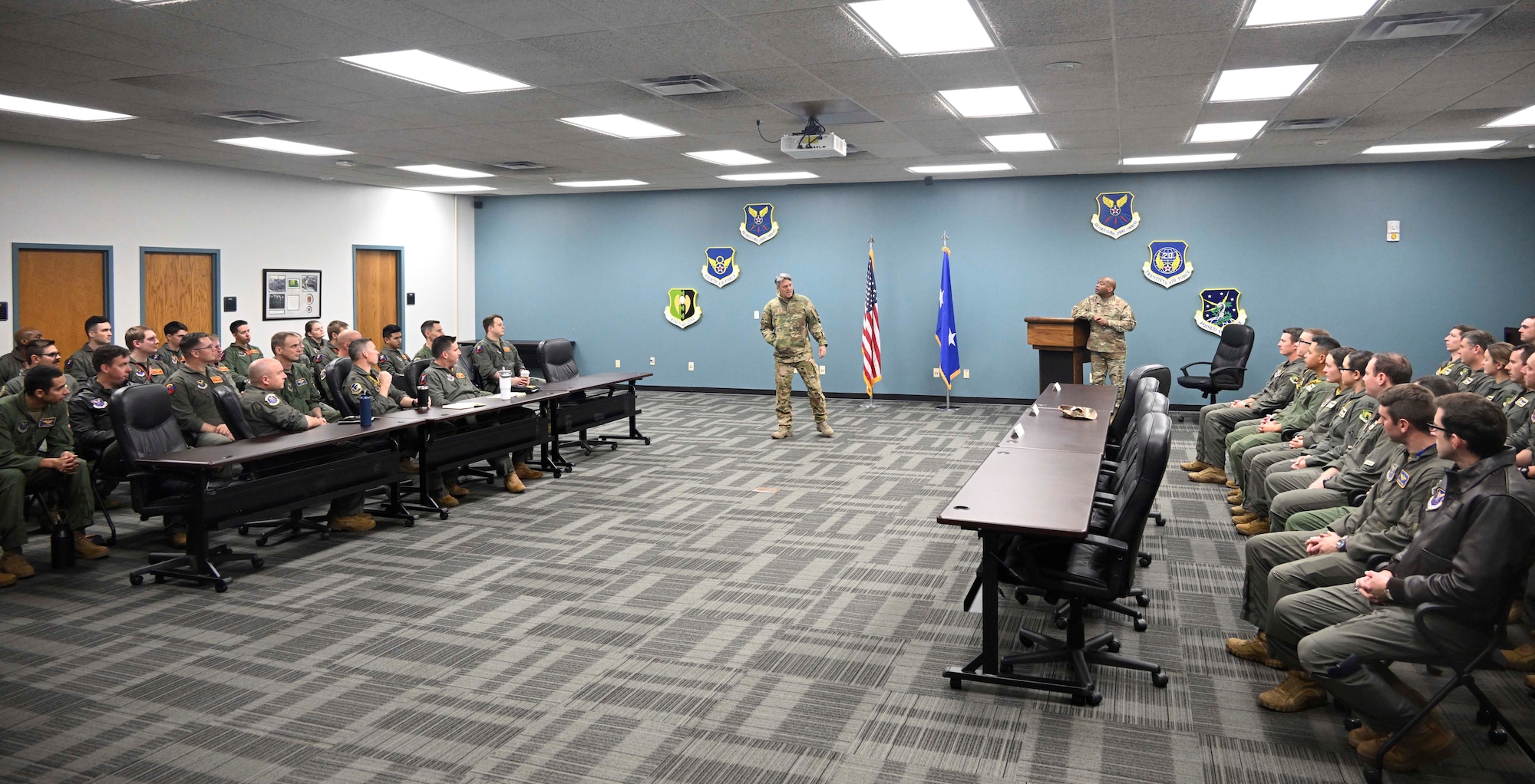 U.S. Air Force Major General Jason R. Armagost, Eighth Air Force and Joint-Global Strike Operations Center commander, and Chief Master Sgt. Ronnie J. Woods, Eighth Air Force command chief, speak to aircrew members from the 23rd and 69th Bomb Squadron at Minot Air Force Base, North Dakota, Nov. 1, 2023. During the visit, Armagost and Woods met Airmen from Team Minot and learned how they contribute to the Eighth Air Force mission. (U.S. Air Force photo by Senior Airman Caleb S. Kimmell)