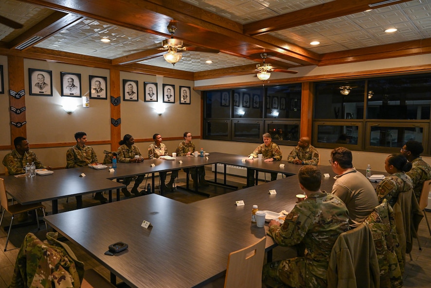 U.S. Air Force Maj. Gen. Jason R. Armagost, Eighth Air Force and Joint-Global Strike Operations Center commander, and Chief Master Sgt. Ronnie J. Woods, Eighth Air Force command chief, have breakfast with Team Minot Airmen at Minot Air Force Base, North Dakota, Nov. 1, 2023. During the visit, Armagost and Woods met Airmen from Team Minot and learned how they contribute to global deterrence. (U.S. Air Force photo by Airman 1st Class Kyle Wilson)