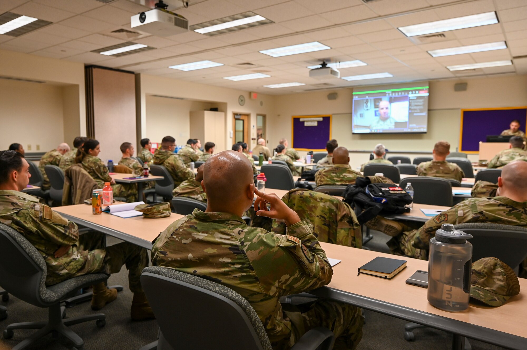 U.S. Airman watching a briefing in class