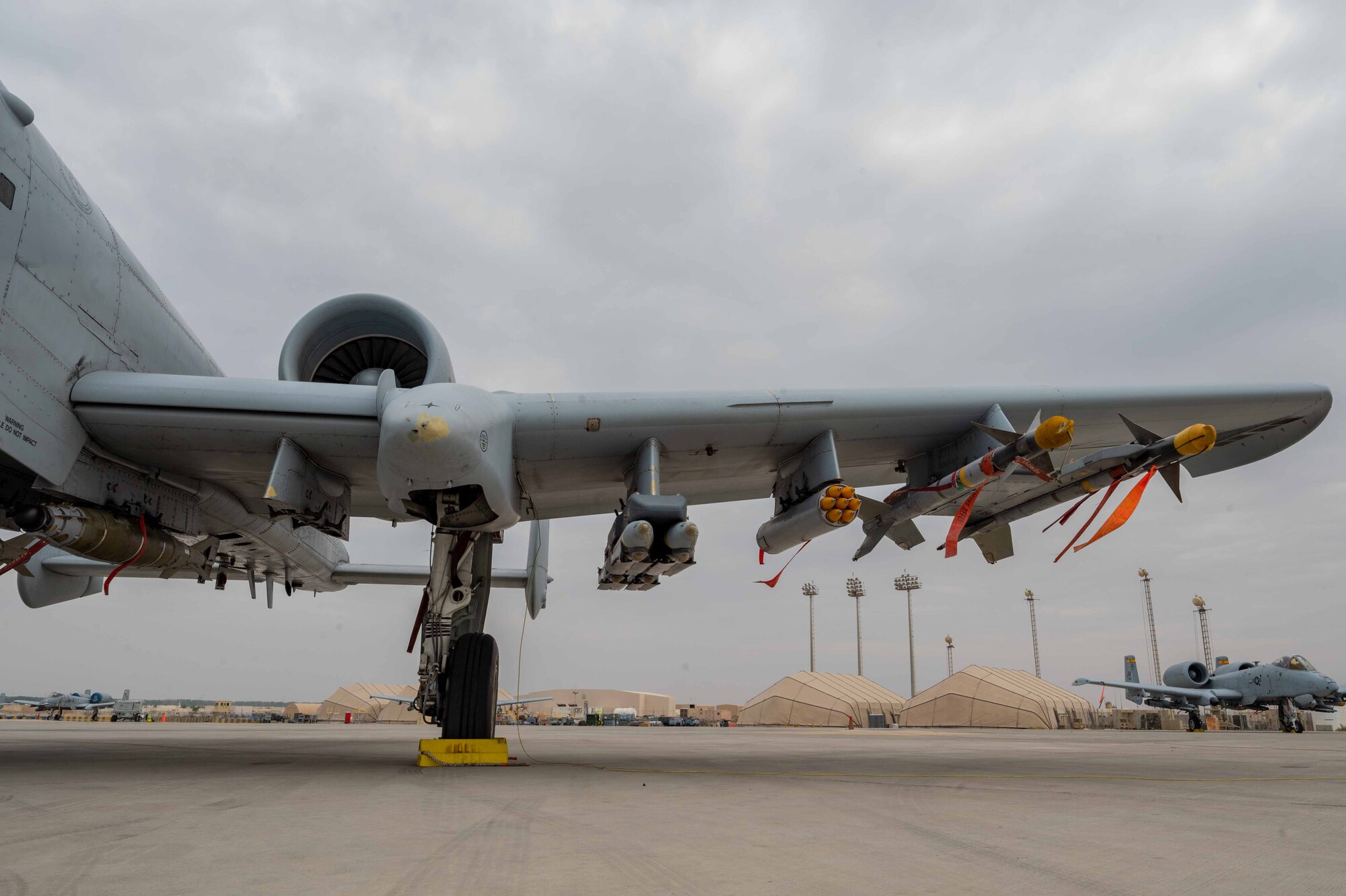 An A-10 Thunderbolt II is armed with munitions.