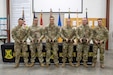 Soldiers who competed in Kentucky's Best Warrior Competition received trophies during a ceremony held in Wendell H. Ford Regional Training Center in Greenville, Kentucky, November 5, 2023. From left: Spc. Jackie Zheng, Soldier of the Year; Command Sgt. Maj. Benzie Timberlake, 75th Troop Command; Sgt. Jerry Marksbury III, NCO of the Year Runner-Up; Sgt. Robert Buck, NCO of the Year; Command Sgt. Maj. Aaron Lester, 149th Maneuver Enhancement Brigade; and Spc. Stephen Shelton, Soldier of the Year Runner-Up.  (U.S. Army National Guard photo by Capt. Cody Stagner)