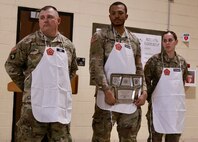 Staff Sgt. Justin Hill of Robinson, Illinois; Spc. Jordan Robinson of Danville, Illinois; and Spc. Samantha Vazquez of Norwood, Illinois. were honored by Chief Warrant Officer 3 Melissa Downey, the Illinois Army National Guard's food service officer, and Command Sgt. Maj. Nicholaus Fordham, the command sergeant major of the 198th Combat Sustainment Support Battalion and the fulltime Illinois Army National Guard logistics sergeant major.