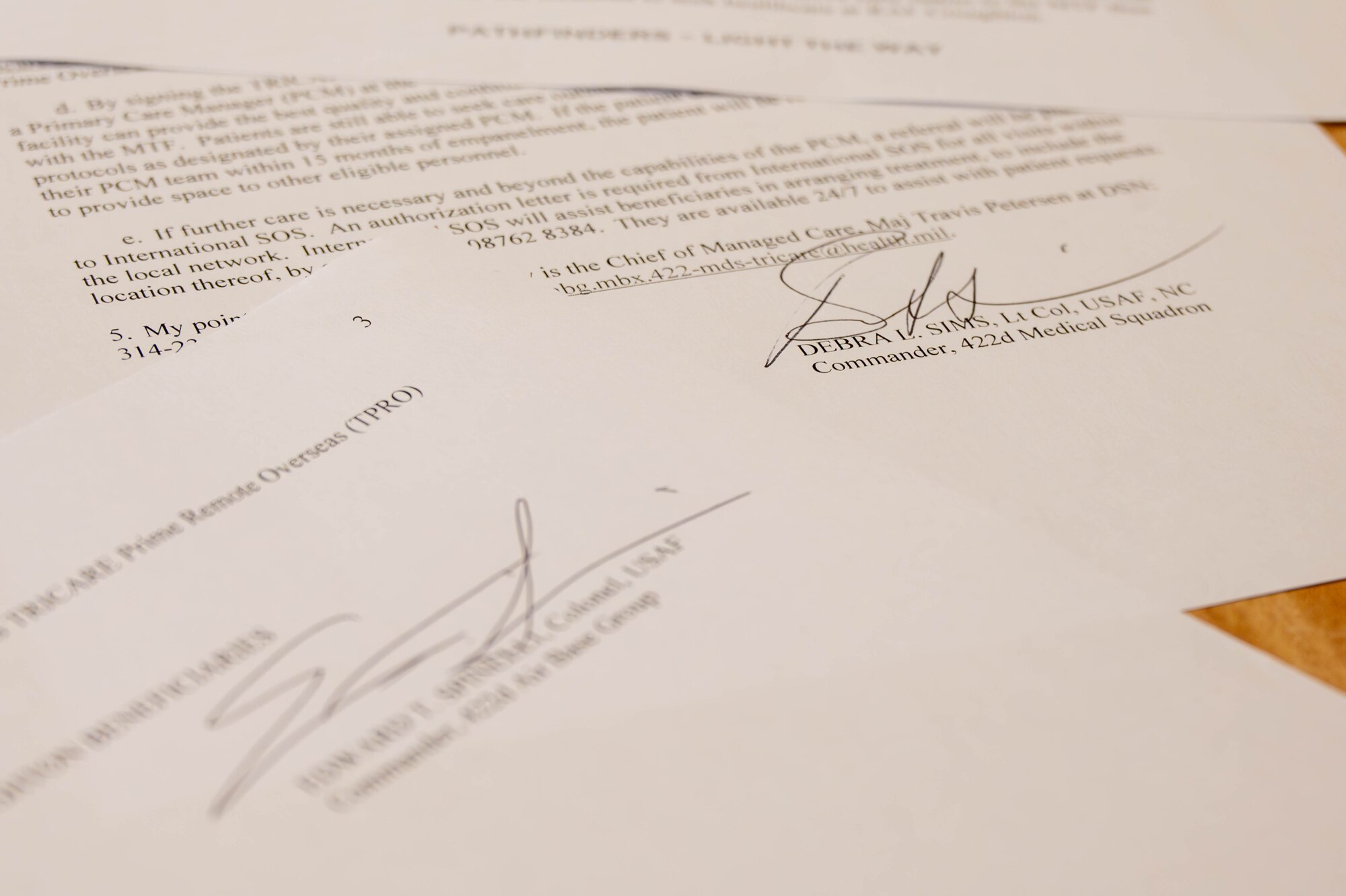 Signatures are seen on an exception to policy letter.