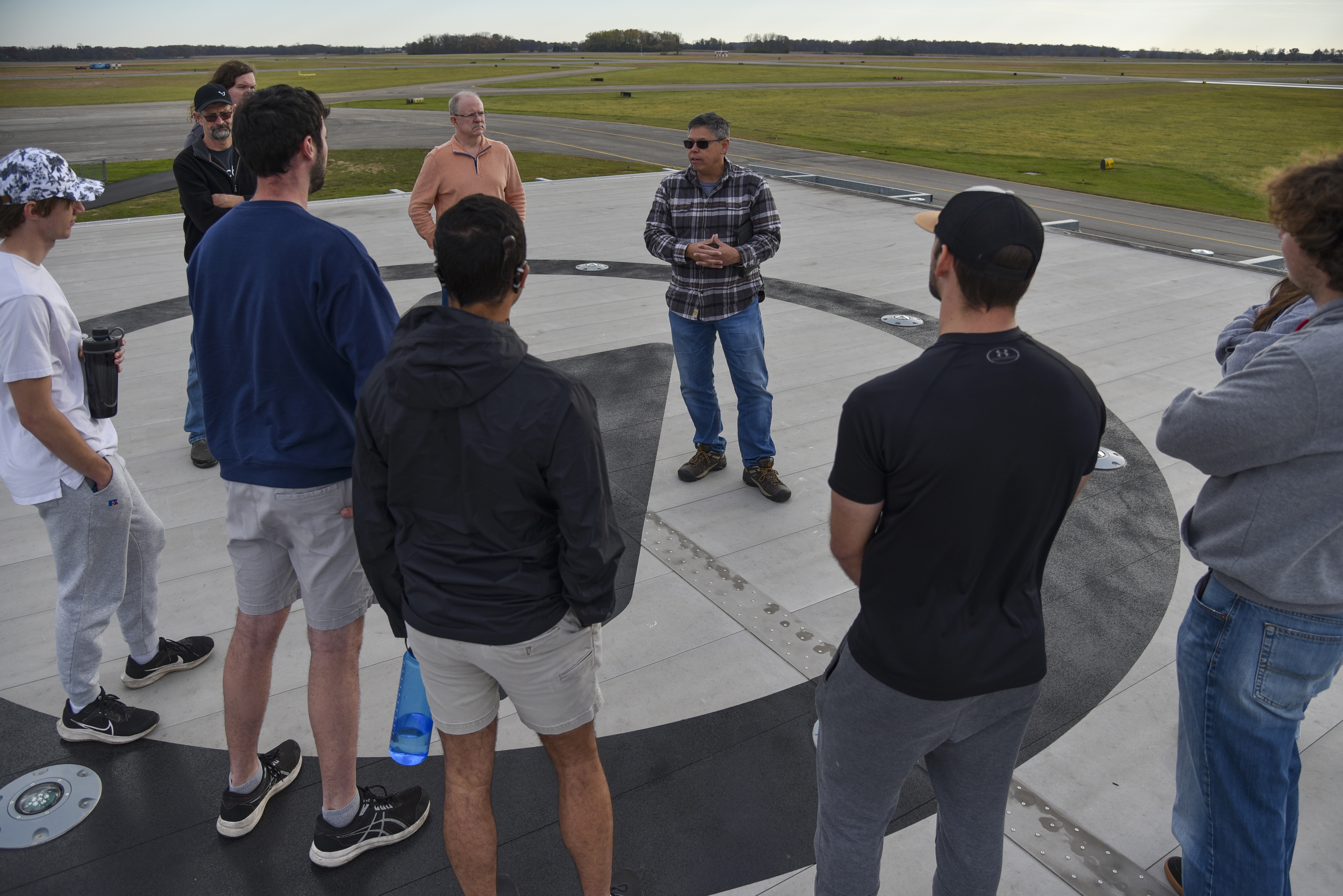Hank Griffiths, AFWERX chief of test and airworthiness, talks to aerospace engineering students from Ohio State University at the Springfield-Beckley Municipal Airport, Ohio, Nov. 7, 2023. Griffiths invited the students to inform them about AFWERX, the innovation arm of the Department of the Air Force, and Advanced Air Mobility. (U.S. Air Force photo by Matthew Clouse)
