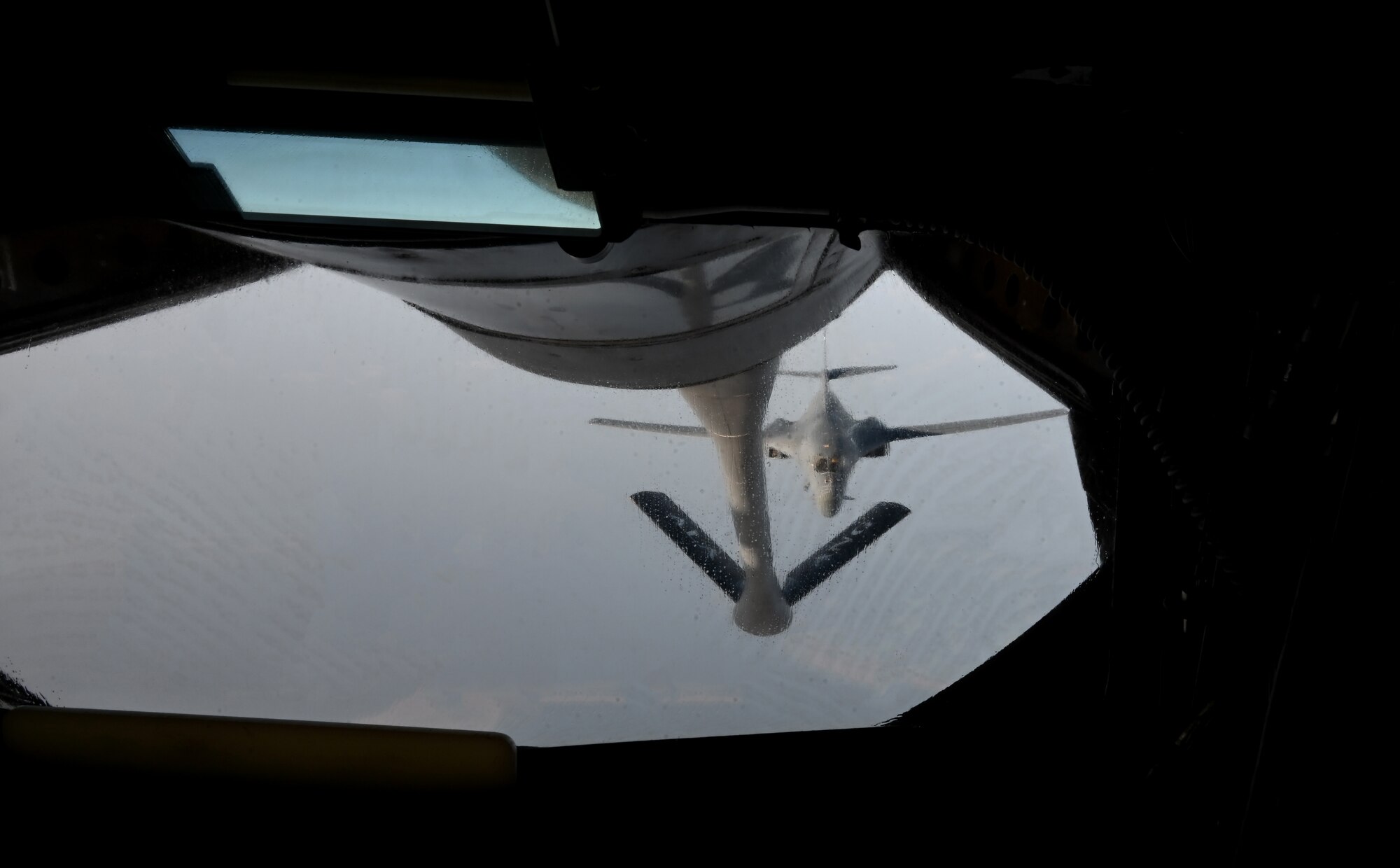 A KC-135 Stratotanker prepares to refuel a B-1 Lancer.