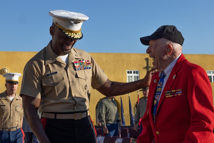 U.S. Marine Corps Commanding General Brig. Gen. James A. Ryans II, Marine Corps Recruit Depot San Diego and the Western Recruiting Region, left, and U.S. Marine Corps Cpl. Don Graves, right, a U.S. Marine Corps veteran, converse after a morning colors ceremony at Marine Corps Recruit Depot San Diego, Nov. 3, 2023. Graves, a distinguished WWII veteran who served with 2nd Battalion, 28th Marine Regiment at Iwo Jima, visited Marine Corps Recruit Depot San Diego to observe training and interact with the Marines. (U.S. Marine Corps photo by Cpl. Alexander O. Devereux)