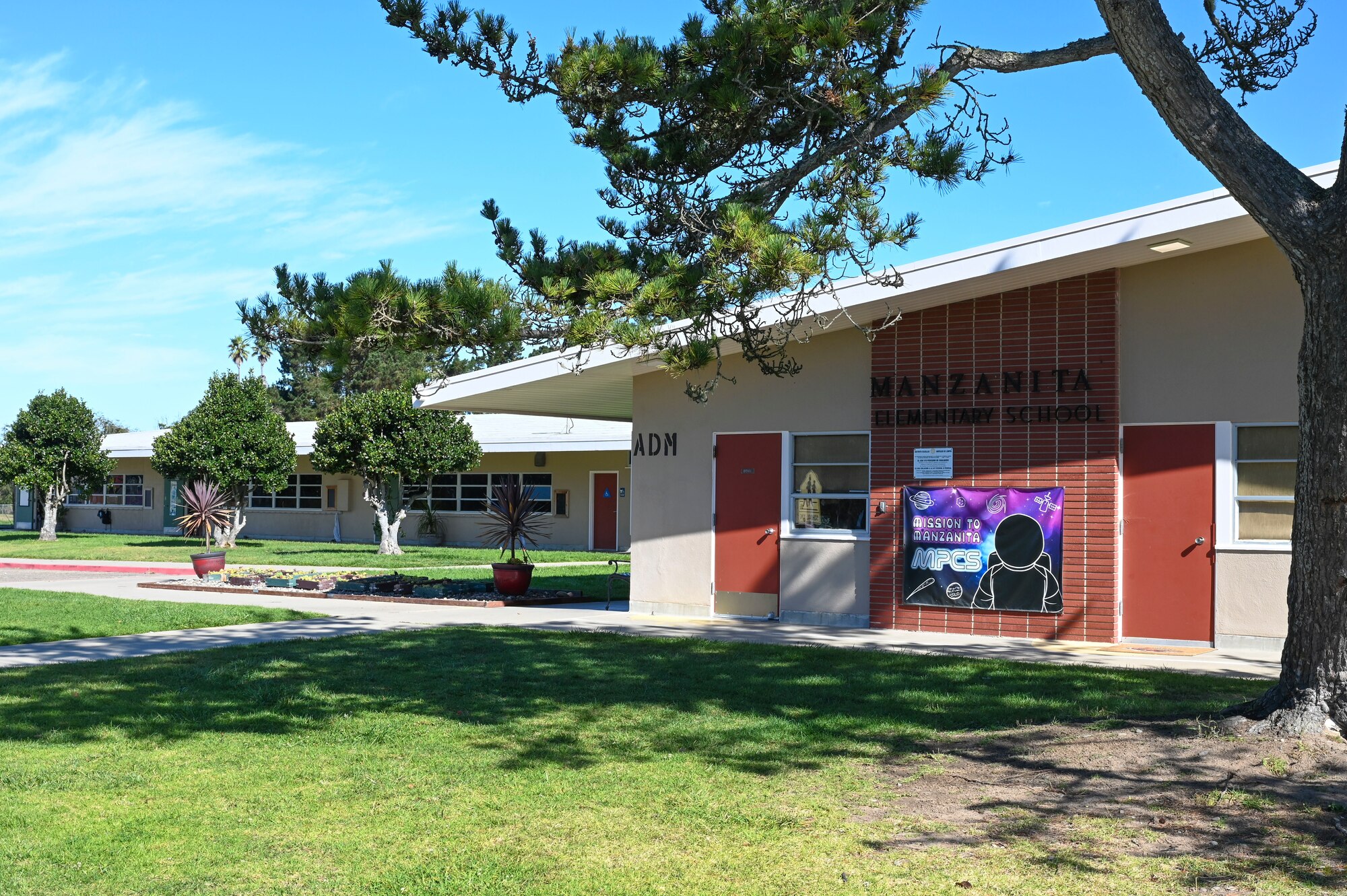 A photo of the Manzanita school outside the front office on a sunny day.