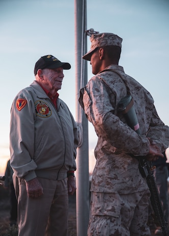 U.S. Marine Corps veteran Cpl. Don Graves presents the company honor graduate with Alpha Company, 1st Recruit Training Battalion, his Eagle, Globe and Anchor at Marine Corps Base Camp Pendleton, California, Nov. 1, 2023. Graves, a distinguished WWII veteran who served with the 2nd Battalion, 28th Marine Regiment at Iwo Jima, visited Marine Corps Recruit Depot San Diego to observe training and interact with the Marines. (U.S. Marine Corps photo by Sgt. Sydney Smith)