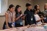 STARBASE students interact on the robotics table, exploring STEM concepts with tangible applications in Los Alamitos, California, Oct. 30, 2023. STARBASE is the Department of Defense’s premier youth outreach program and a beacon of enrichment for underserved, underrepresented and underestimated youth across the United States.