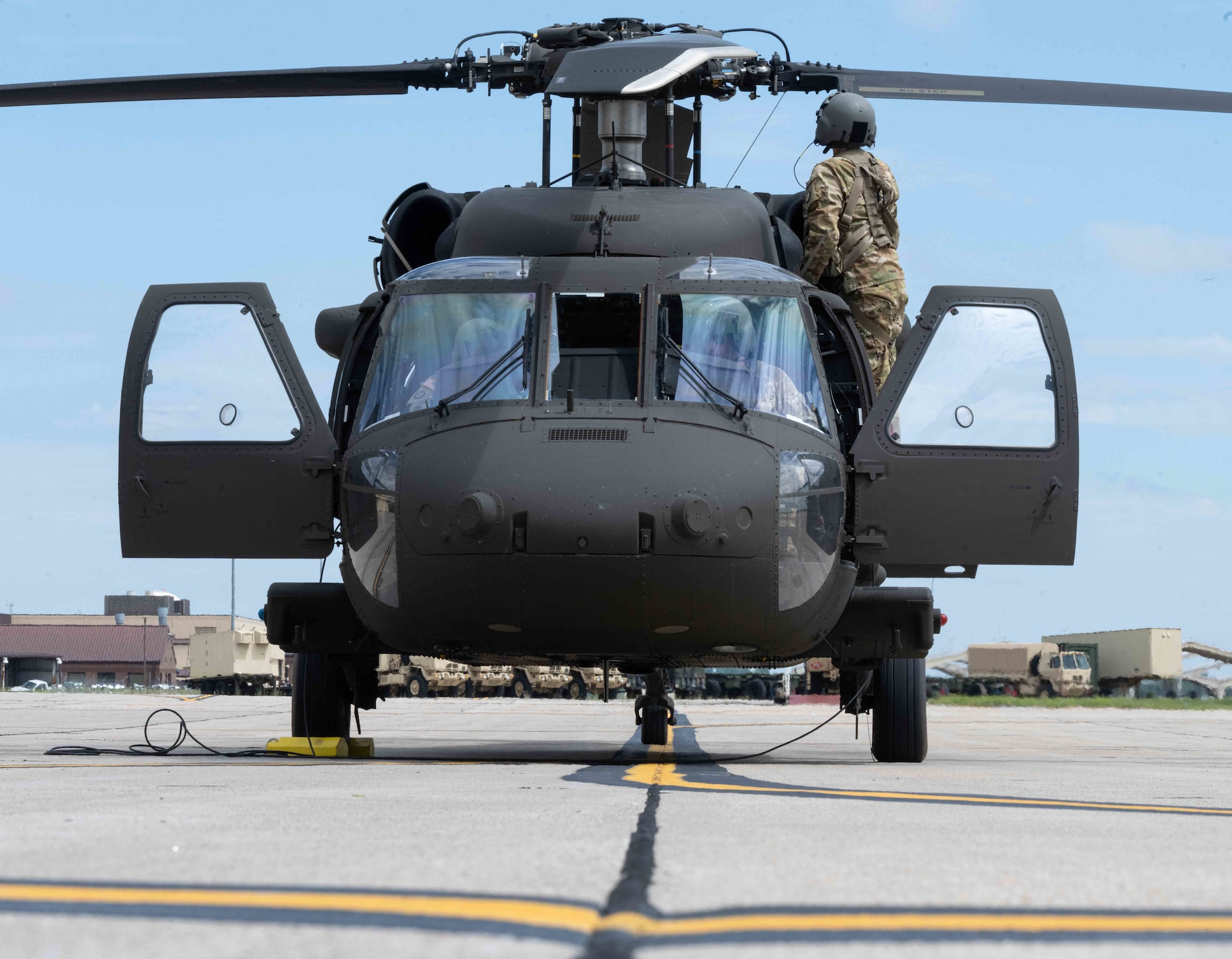 A UH-60 Black Hawk assigned to the 1-135th Assault Helicopter Battalion, Missouri National Guard, prepares for takeoff on the runway on Whiteman Air Force Base, Mo. on June 22, 2022. The 1-135th mobilizes and deploys on order to a theater of operations and conducts unified land operations in joint and coalition environments supporting a Regional Combatant Commander or provides defense support to civil authorities within the United States as directed. (U.S. Air Force photo by Airman 1st Class Bryson Britt)
