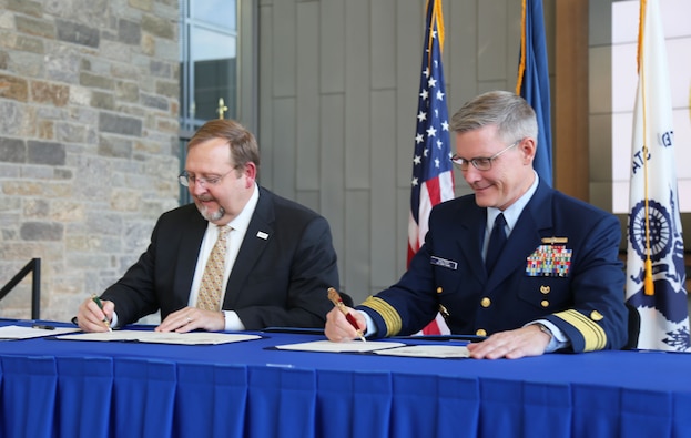 Deputy Assistant to the Administrator for the Bureau of Humanitarian Assistance, Matt Nims (left), and Coast Guard Deputy Commandant for Operations, Adm. Peter Gautier (right)