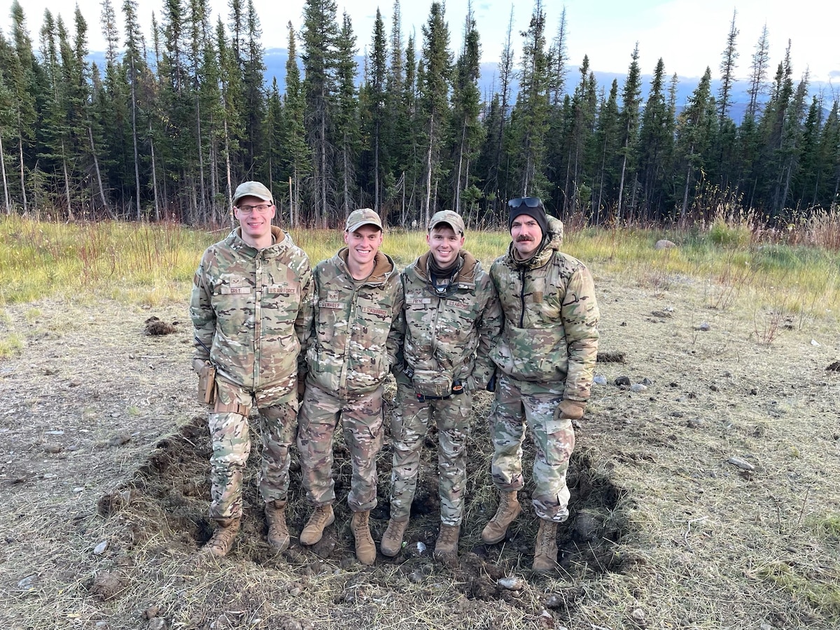 U.S. Air Force 354th Civil Engineering Squadron Explosive Ordnance Disposal technicians pose for a group photo after executing a controlled detonation successfully near Tok, Alaska, Sep. 28, 2023.