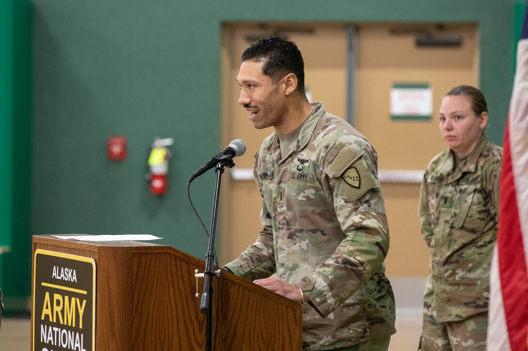 Alaska Army National Guard 1st Lt. Kenneth McCoy, incoming commander for the 297th Military Police Detachment, makes his opening remarks after taking command of the unit during an activation ceremony for the detachment at the Alcantra Armory in Wasilla, Alaska, Nov. 2, 2023.