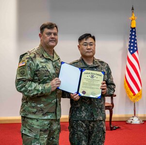 Lt. Gen. Willard M. Burleson III, chief of staff, Combined Forces Command (CFC), presents awards to member of the Republic of Korea military during a ceremony honoring the 45th Anniversary of the formation of the CFC, on U.S. Army Garrison-Humphreys Nov. 7, 2023. (U.S. Army photo by: Cpl. Jorge Reyes, Eighth Army Public Affairs)