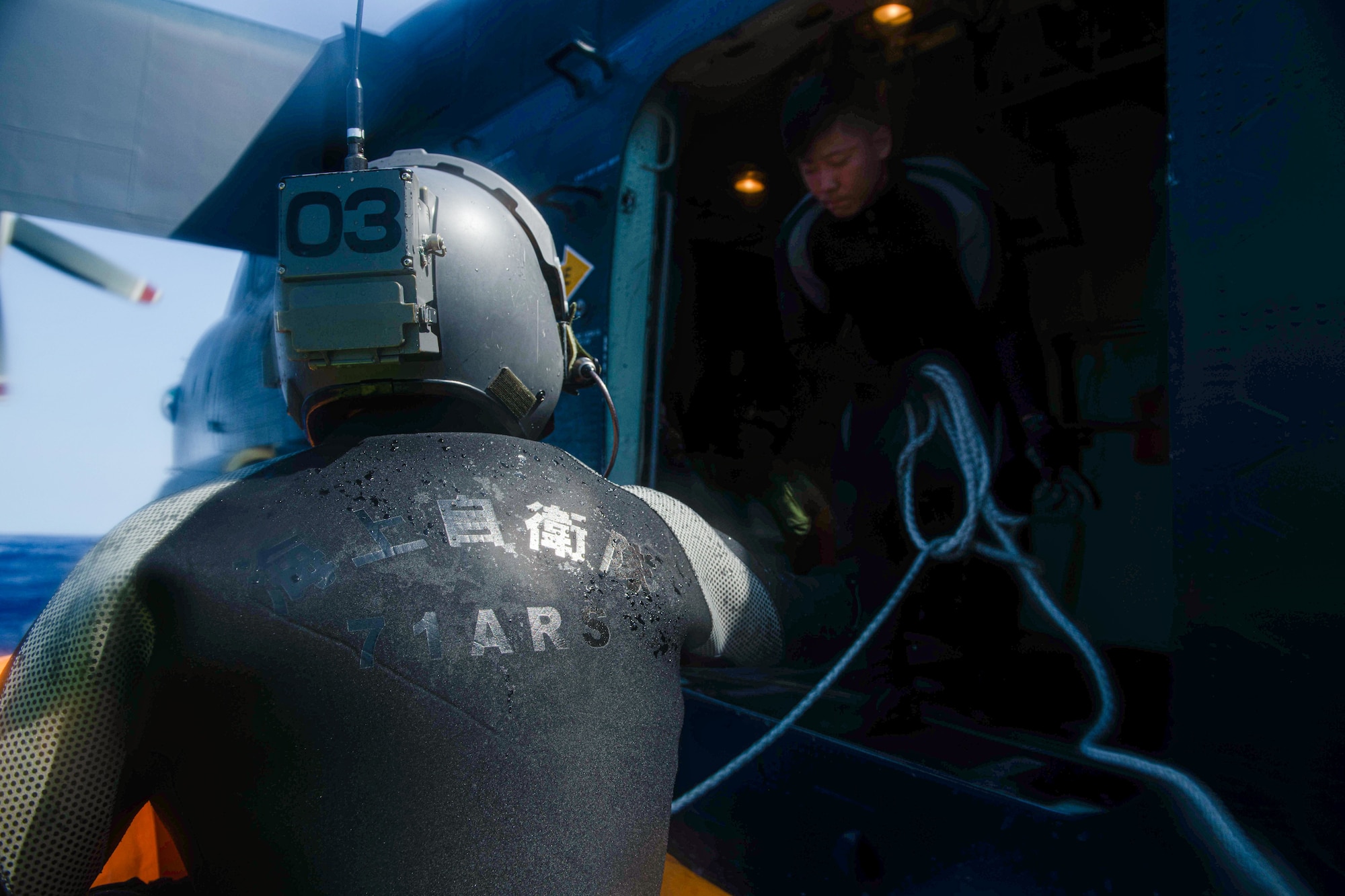 A Japan Air Self-Defense Force service member boards an inflatable boat during Rescue Flag Okinawa 2023 at Kadena Air Base, Japan, Oct. 26, 2023.