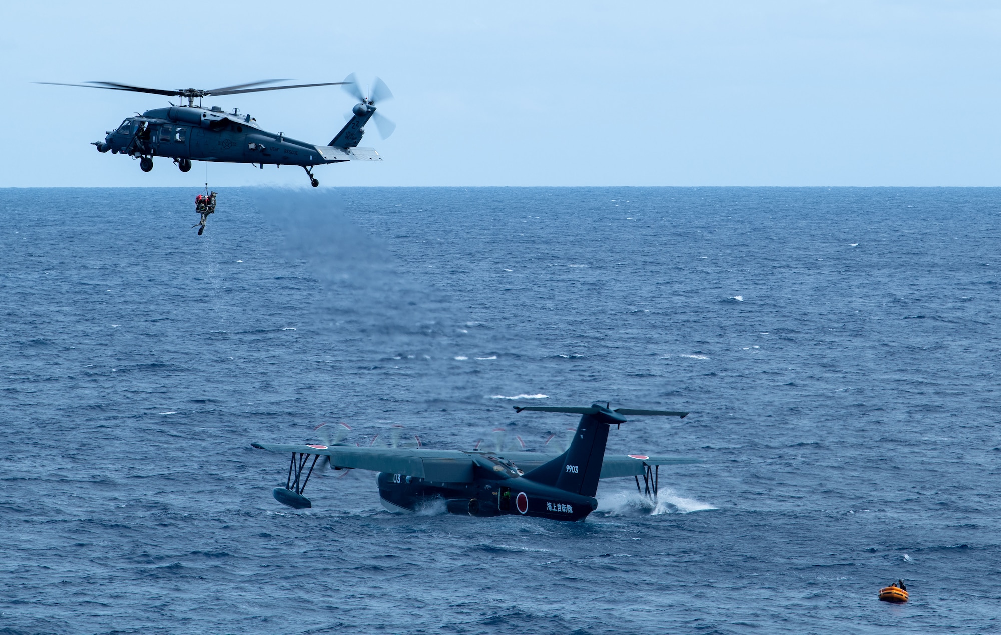 Japan Air Self-Defense Force and U.S. Air Force service members participate in a water rescue training during Rescue Flag Okinawa 2023 at Kadena Air Base, Japan, Oct. 24, 2023.