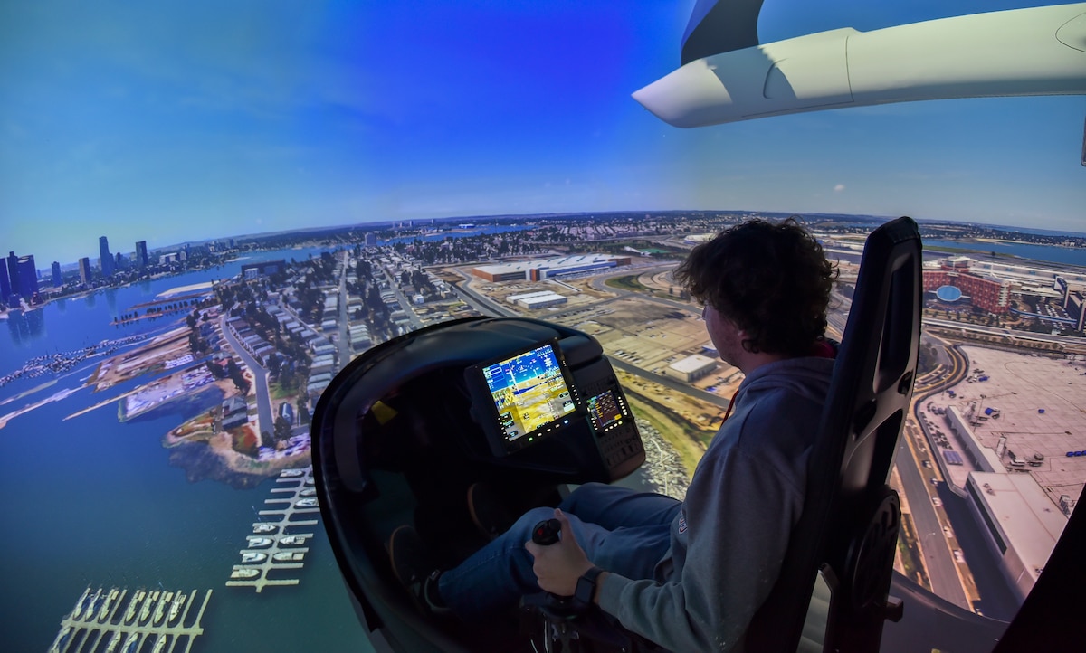 Henry Kitchen, Ohio State University aerospace engineering sophomore, flies in the BETA Technologies flight simulator at the Springfield-Beckley Municipal Airport, Ohio, Nov. 7, 2023. Kitchen was invited to the airport to learn about AFWERX, the innovation arm of the Department of the Air Force, and Advanced Air Mobility. (U.S. Air Force photo by Matthew Clouse)