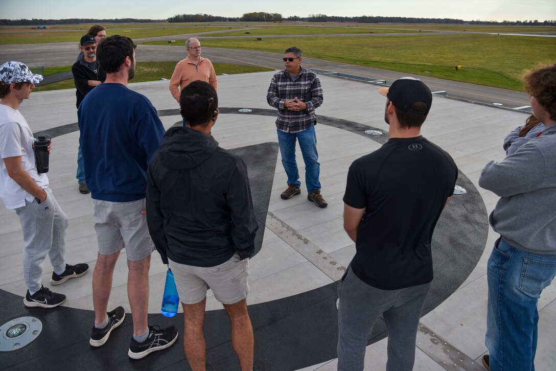 Hank Griffiths, AFWERX chief of test and airworthiness, talks to aerospace engineering students from Ohio State University at the Springfield-Beckley Municipal Airport, Ohio, Nov. 7, 2023. Griffiths invited the students to inform them about AFWERX, the innovation arm of the Department of the Air Force, and Advanced Air Mobility. (U.S. Air Force photo by Matthew Clouse)